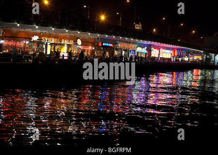 Restaurants under Galata Bridge at night, Istanbul, Turkey. Stock Photo