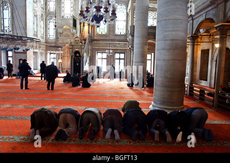 Muslims praying in Eyup Sultan Camii Mosque, Eyup, Istanbul, Turkey Stock Photo