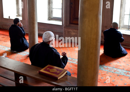 Muslims praying in Eyup Sultan Camii Mosque, Eyup, Istanbul, Turkey Stock Photo