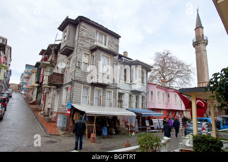 Old wooden architecture houses standing next to The Byzantine Church of St. Savior in Chora,  Edirnekapı, Istanbul, Turkey Stock Photo