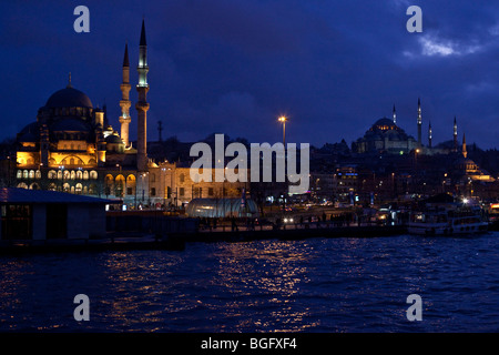 Yeni Valide Camii - New Mosque (L) and Suleymaniye mosque (R) at night Istanbul, Turkey Stock Photo