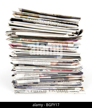 Stack of newspapers on a white background Stock Photo