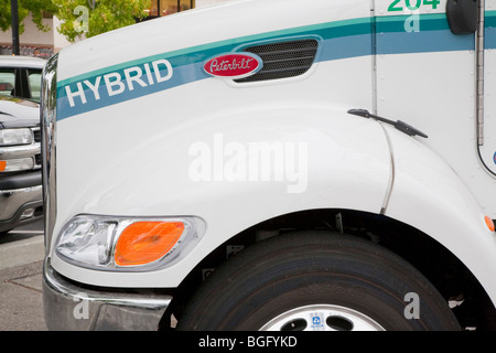 Close Up of Hood of Peterbilt Hybrid Electric (HE) Truck Model 330 Class 6 vehicle. California, USA. Stock Photo