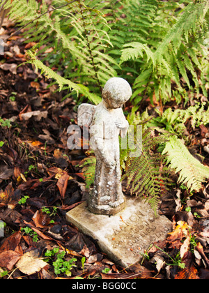 an angel on a gravestone in a country cemetery Stock Photo