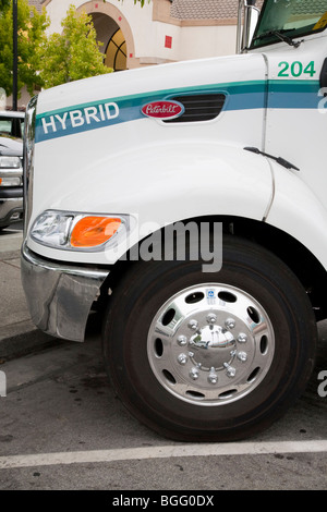 Close Up of Hood of Peterbilt Hybrid Electric (HE) Truck Model 330 Class 6 vehicle. California, USA. Stock Photo