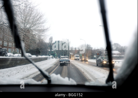 Driving on roads during a snow storm in Brighton Sussex UK January 2010 Stock Photo