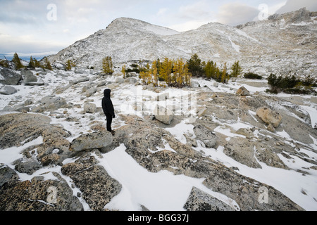 A person in black clothing standing in the upper Enchantments below Little Annapurna, Enchantment Lakes Wilderness Stock Photo