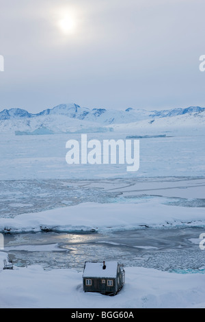 House in snow, Tiniteqilaq in winter, E. Greenland Stock Photo