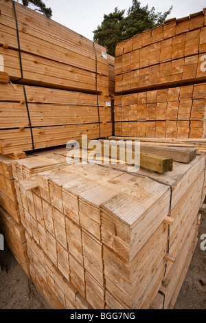 Modern treated wooden fencing in stacks at timber Merchants, England Stock Photo