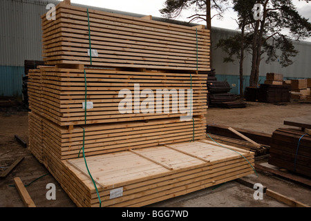 Modern treated wooden fencing in stacks at timber Merchants, England Stock Photo