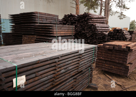 Modern treated wooden fencing in stacks at timber Merchants, England Stock Photo