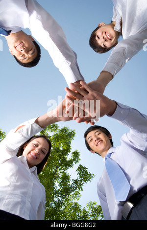 Business professionals in huddle Stock Photo