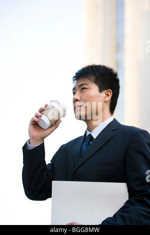 Man with coffee and documents Stock Photo