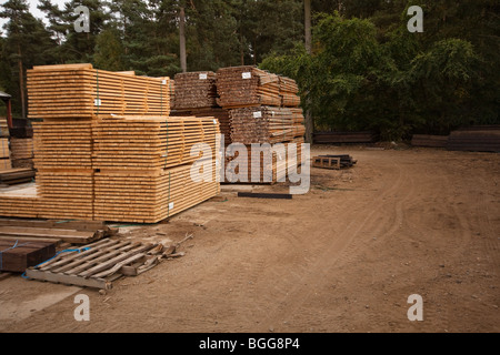 Modern treated wooden fencing in stacks at timber Merchants, England Stock Photo