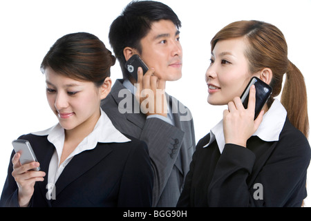 Businessmen using cell phones Stock Photo