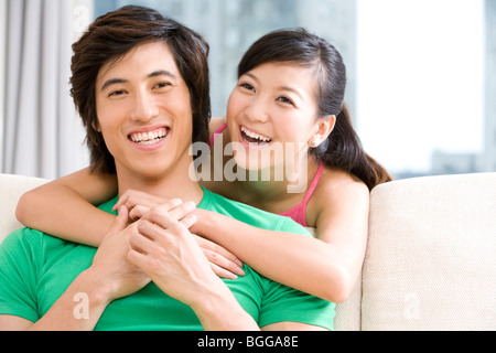Asian couple holding each other Stock Photo