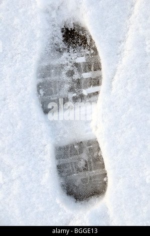 Footprint in the snow Stock Photo