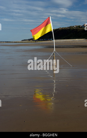 lifeguard bathing are a flag on beach at cromer north norfolk england Stock Photo