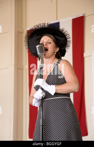 1940s style singer performing at Mid-Atlantic Air Museum World War II Weekend and Reenactment in Reading, PA held June 18, 2008 Stock Photo