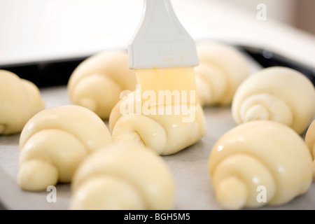 Unbaked bread on a tray Stock Photo