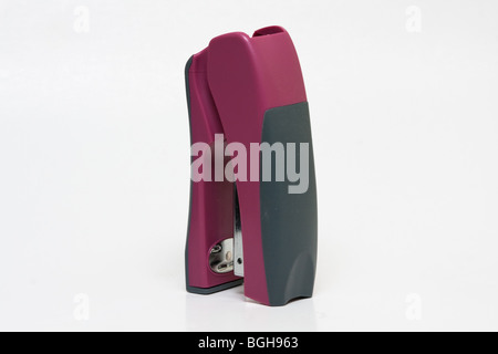 Red stapler with hand grip against white background, side views, front view and standing view Stock Photo