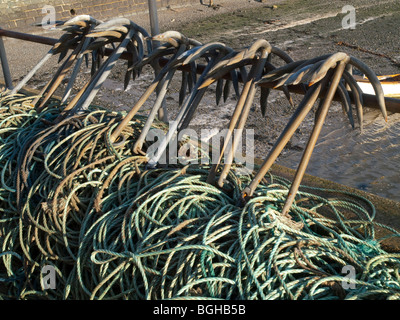 A row of metal anchors in the harbor area of Aberdovey (Aberdyfi), Gwynedd Mid Wales UK Stock Photo