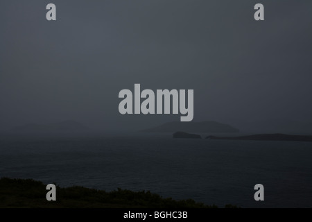 Islands in a lake on a foggy day. Thingvallavatn lake, Thingvellir NP. Southwest Iceland. Stock Photo