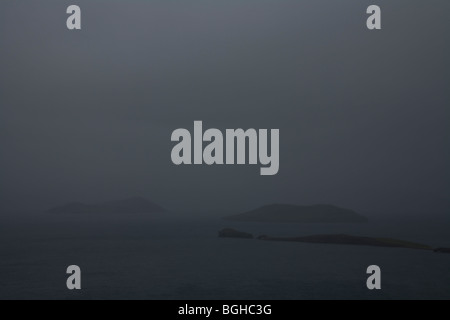 Islands in a lake on a foggy day. Thingvallavatn lake, Thingvellir NP. Southwest Iceland. Stock Photo