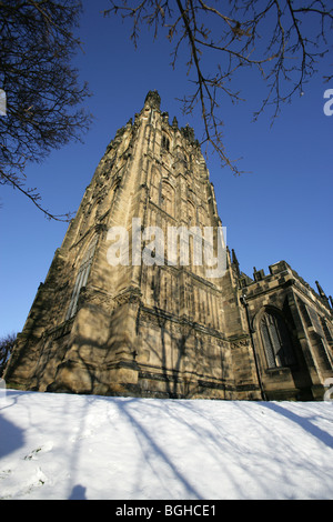 Town of Wrexham, Wales. The 16th century St Giles’ parish church on a snowy winters day. Stock Photo