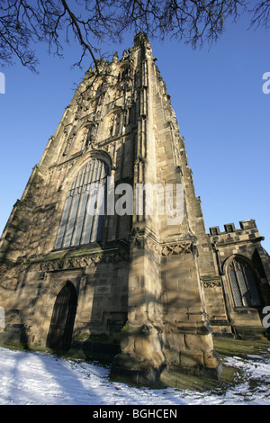Town of Wrexham, Wales. The 16th century St Giles’ parish church on a snowy winters day. Stock Photo