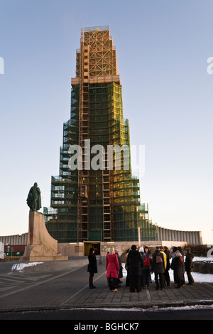 A group of women talking in front of Hallgrimskirkja church. Downtown Reykjavik, Iceland. Stock Photo