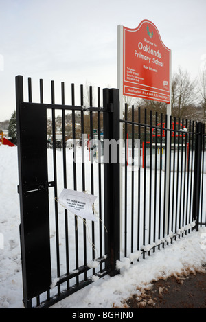 Closed notice on school gates. Stock Photo