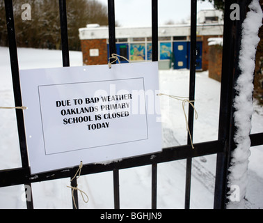 Closed notice on school gates. Stock Photo