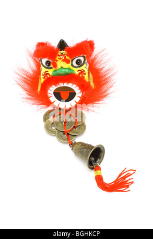 Chinese New Year ornaments lion head, gold coins and bell on white Stock Photo