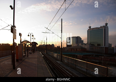 Sunset, Pomona Metrolink Station, Pomona Strand, Exchange Quay in the background, Salford Quays, Old Trafford, Manchester, UK Stock Photo