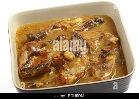 Chicken legs braised in a lemon and garlic sauce, a traditional mediterranean  recipe common to France, Italy and Spain Stock Photo