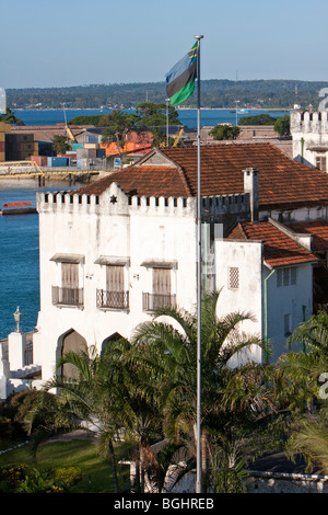 Zanzibar, Tanzania. Former Sultan's Palace, now The Palace Museum. Built 1890s. Zanzibar Flag. Stock Photo