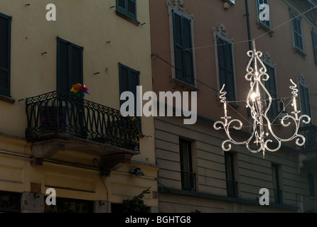 Christmas decoration reflecting the winter sun, suspended above a street in Milan,Lombardy, Italy, Europe  on Christmas Day Stock Photo
