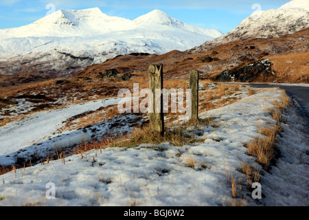 Ben More (left) on the Isle of Mull covered in snow with A'Chioch (right). Stock Photo