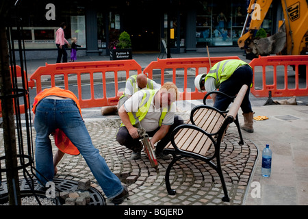 Modern cobblestone being laid Stock Photo