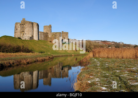 Kidwelly Castle reflected in the Gwendraeth River Carmarthenshire Wales Cymru UK GB Stock Photo