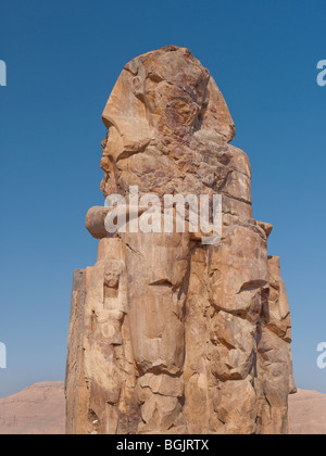 The Colossi of Memnon close to the Valley of of the Kings on the West Bank of the River Nile in Egypt Stock Photo