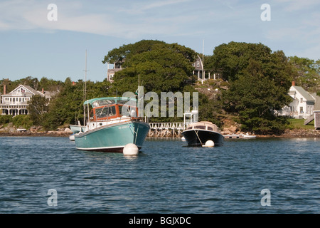 Runabouts moored in Christmas Cove on the Damariscotta River Stock Photo