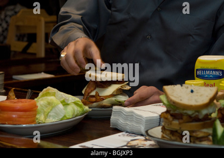 Professional Bull Rider J. B. Mauney, the 2009 World Champ runner up makes the PBR Bull Bucking Hero sandwich at the Stage Deli Stock Photo