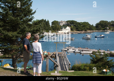 Man and woman overlooking the anchorage at Christmas Cove on the Damariscotta River Stock Photo