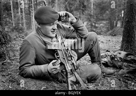 Swedish conscript soldier listening to soccer game during maneuvers 1988. K3 Ranger Battalion, Karlsborg, Sweden. Stock Photo