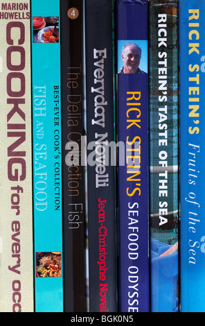 row of cookery books by Rick Stein, Jean-Christophe Novelli, Delia Smith and Marion Howells Stock Photo