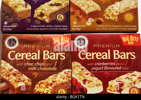 boxes of four different types of Premium Cereal Bars Quality Snacks Stock Photo