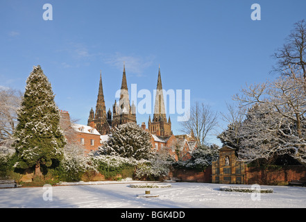 Three spires Cathedral seen from War Memorial Garden of Remembrance on snowy winter’s day 2010 Lichfield Staffordshire England Stock Photo