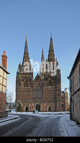 Lichfield Cathedral three spires seen from the Close Lichfield Staffordshire on snowy winter’s day 2010 Stock Photo